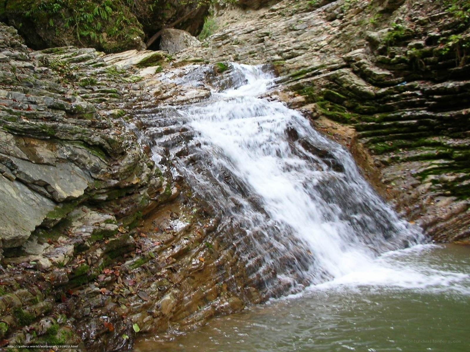Waterfall on rocky cliff
