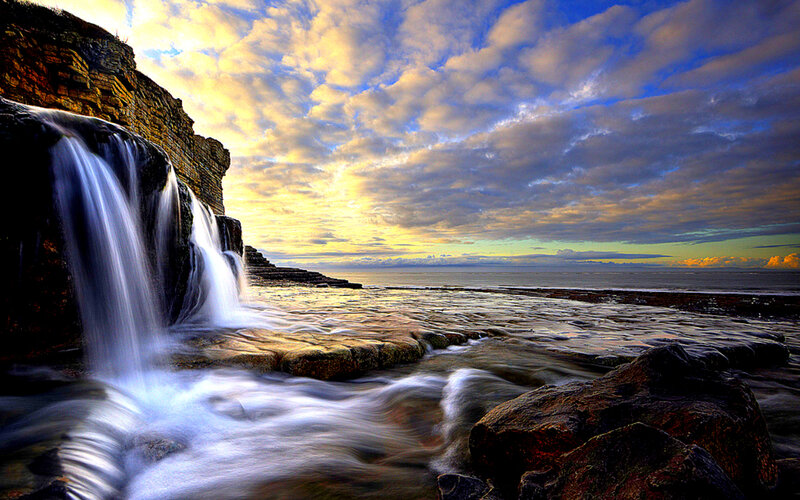 Waterfall on Rocky Coast — Blue
