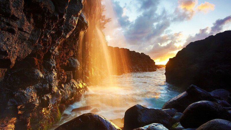 Waterfall on Rocky Coast — Orange, Dramatic