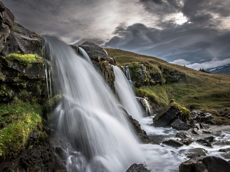 Waterfall on Rocky Hillside — Green, Dramatic