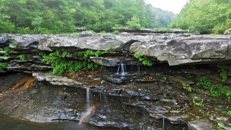 Waterfall on rocky riverbed