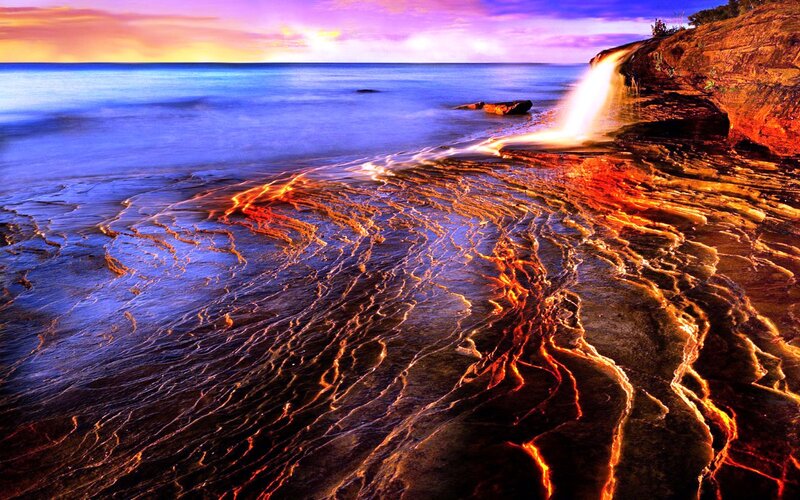 Waterfall on Rocky Shore — Blue, Dramatic, Sunset