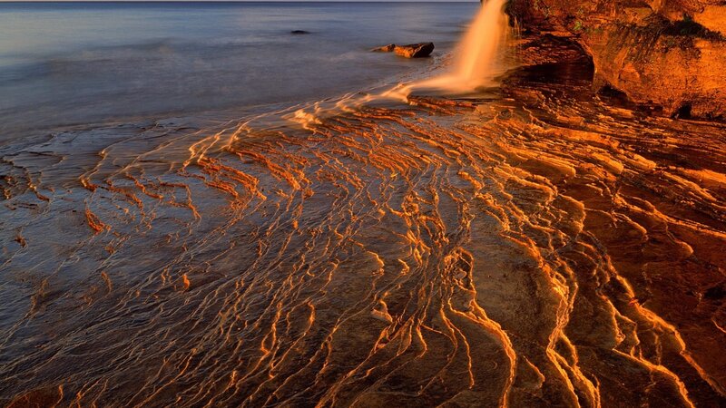 Waterfall on Rocky Shore — Orange