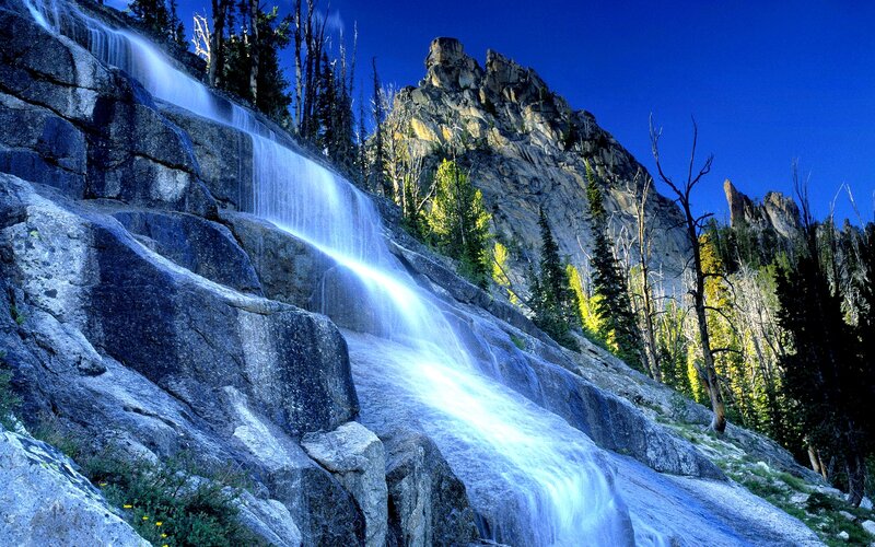 Waterfall on Rocky Slope — Blue, Dramatic