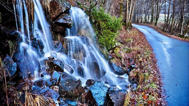 Waterfall on Rocky Slope — Blue, Serene
