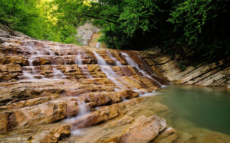 Waterfall on Rocky Slope — Green, Serene, Afternoon, Photograph