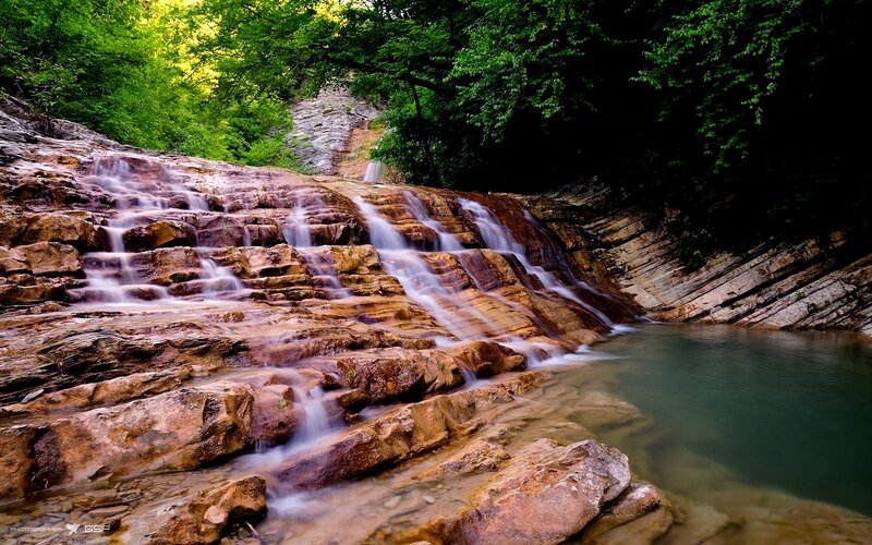 Waterfall on Rocky Slope — Green, Serene, Afternoon