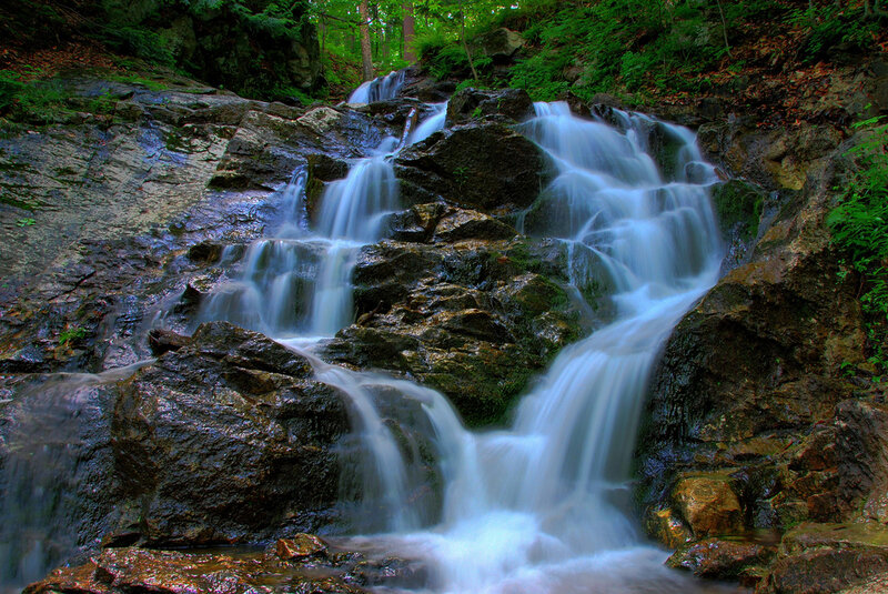 Waterfall on Rocky Slope — Green, Serene
