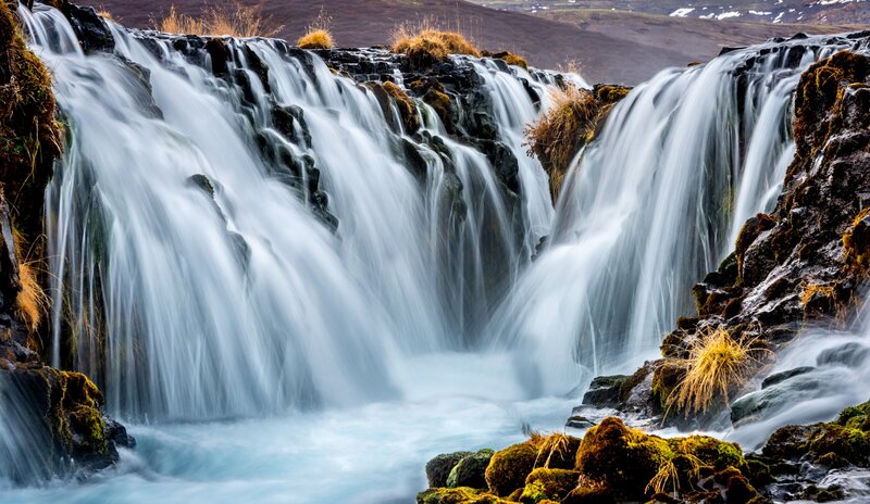 Waterfall on Rocky Terrain — Blue, Serene