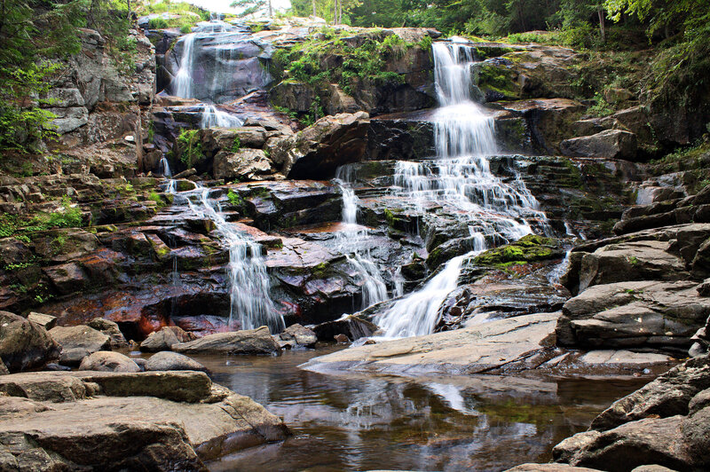 Waterfall on Rocky Terrain — Green, Serene, Afternoon