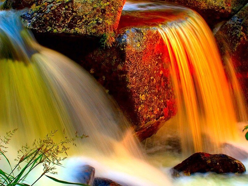 Waterfall over colorful rocks