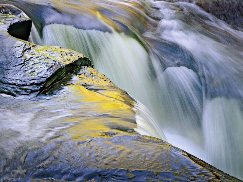 Waterfall over mossy rocks