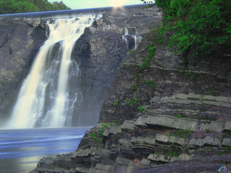 Waterfall over Rock Cliff