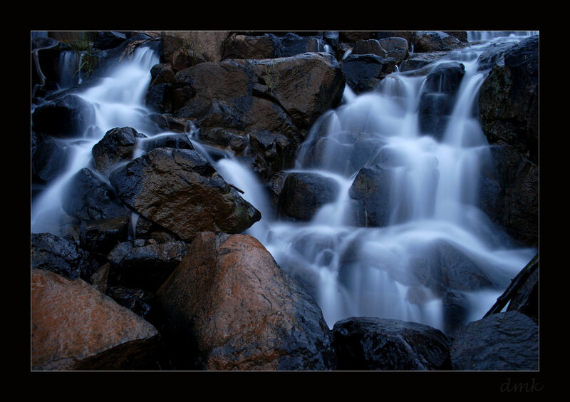 Waterfall over rocks at dusk