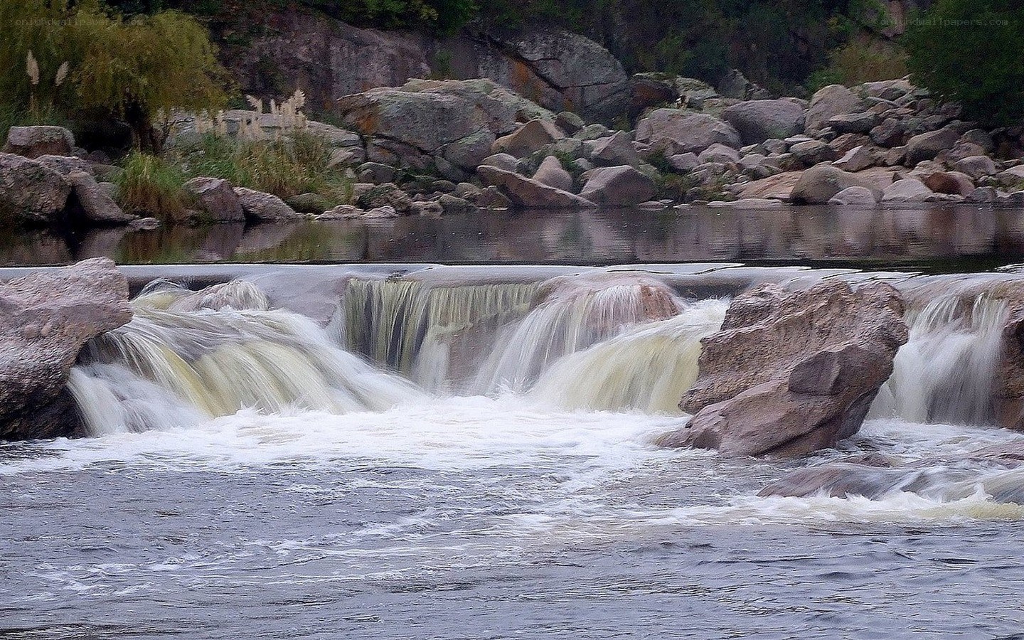 Waterfall over rocks in forest