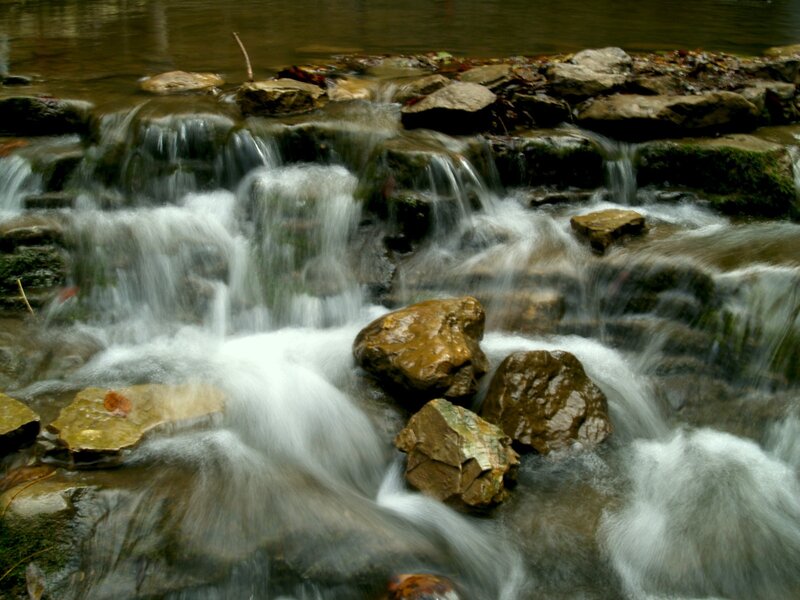 Waterfall over rocks in forest
