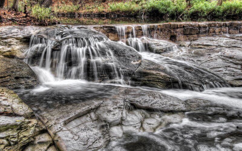 Waterfall over rocks in forest
