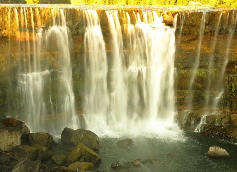 Waterfall over Rocks — Yellow