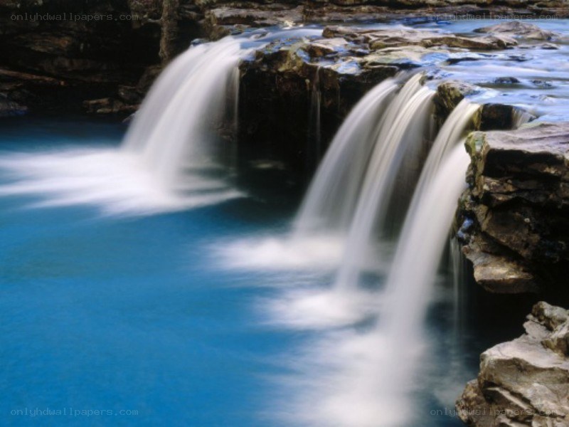 Waterfall over rocky cliff