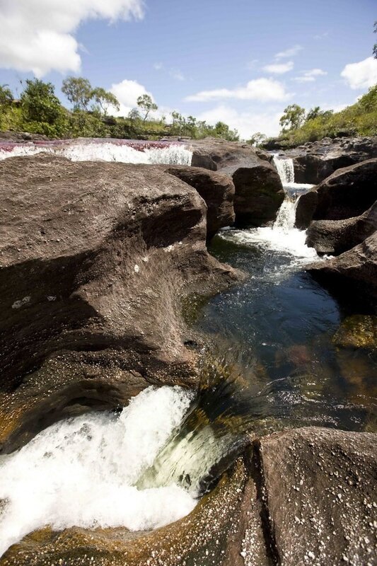 Waterfall over rocky terrain