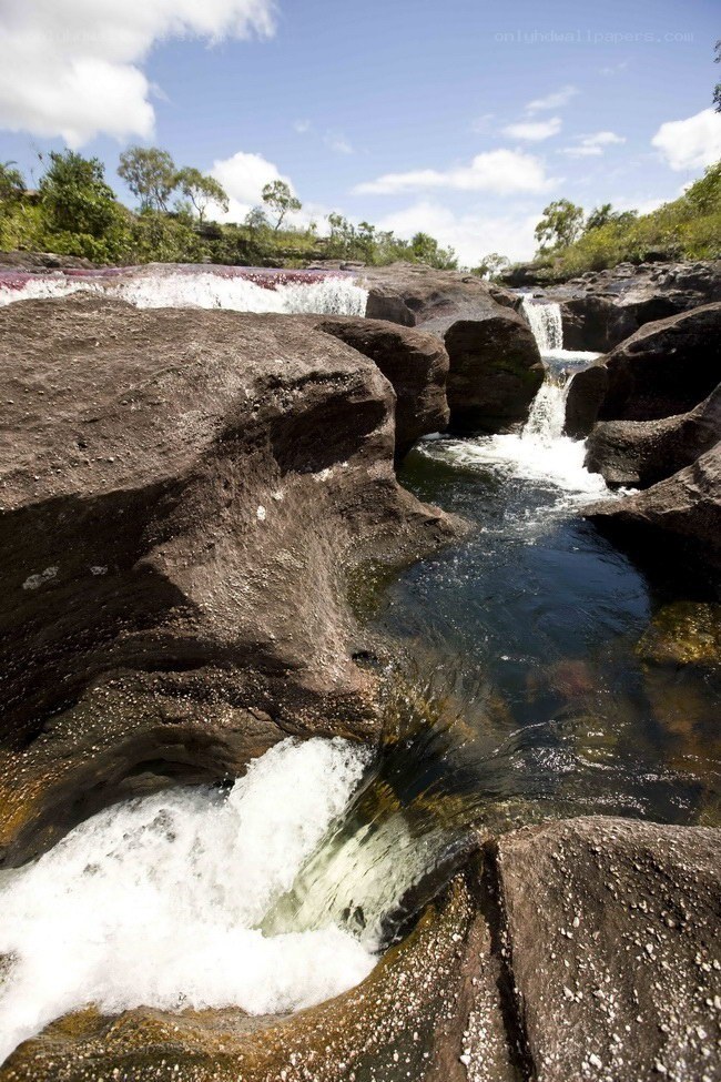Waterfall over rocky terrain