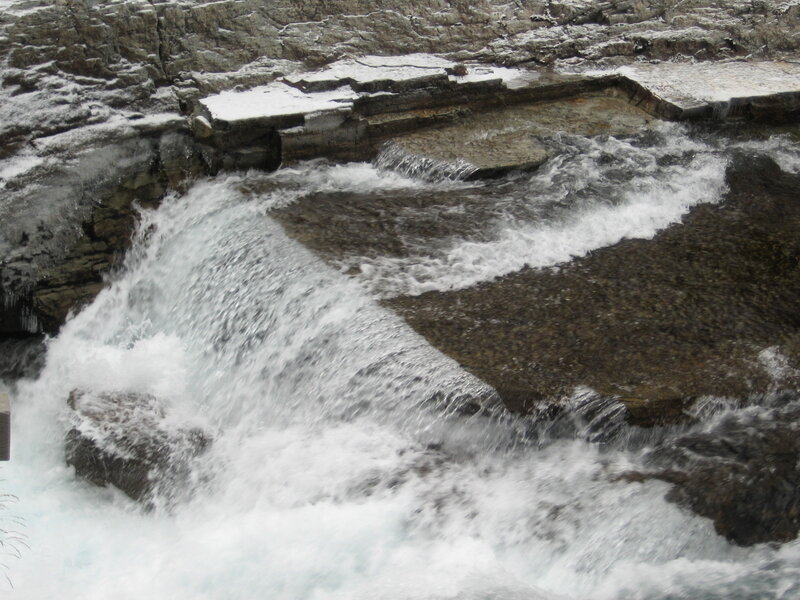 Waterfall over rocky terrain