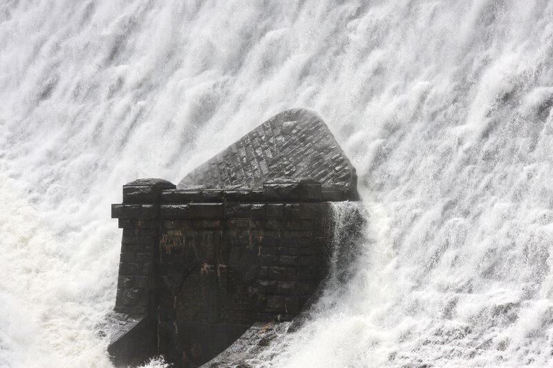 Waterfall over stone structure