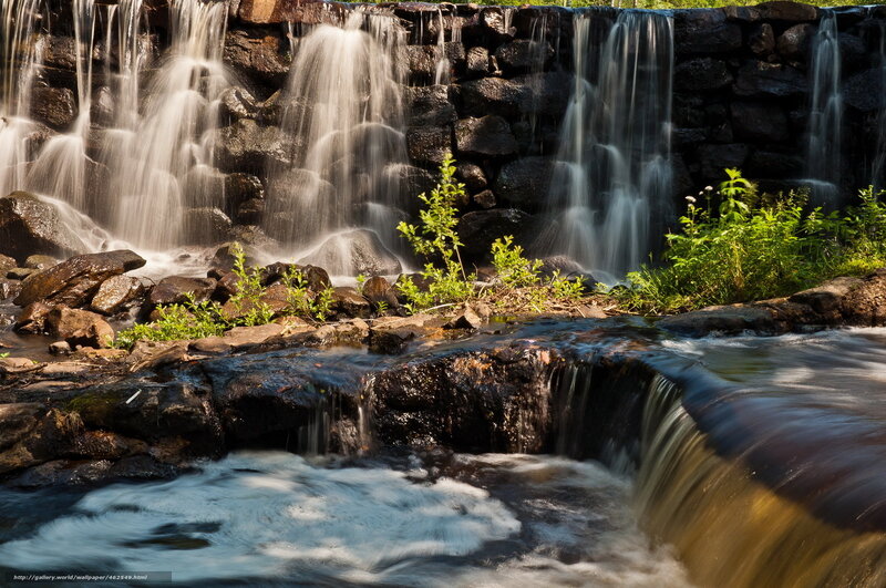 Waterfall over stone wall