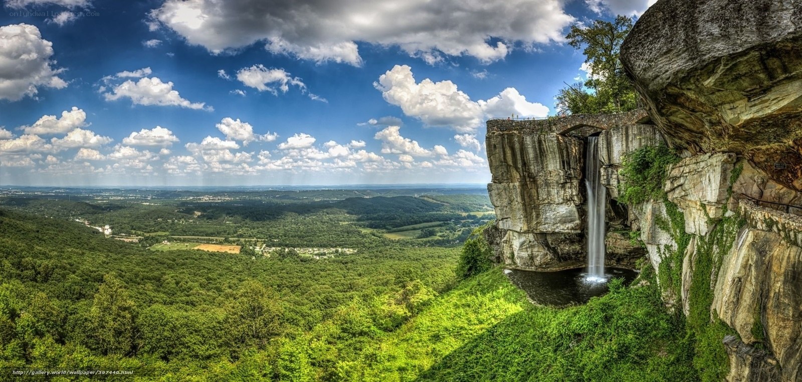 Waterfall overlooking green valley