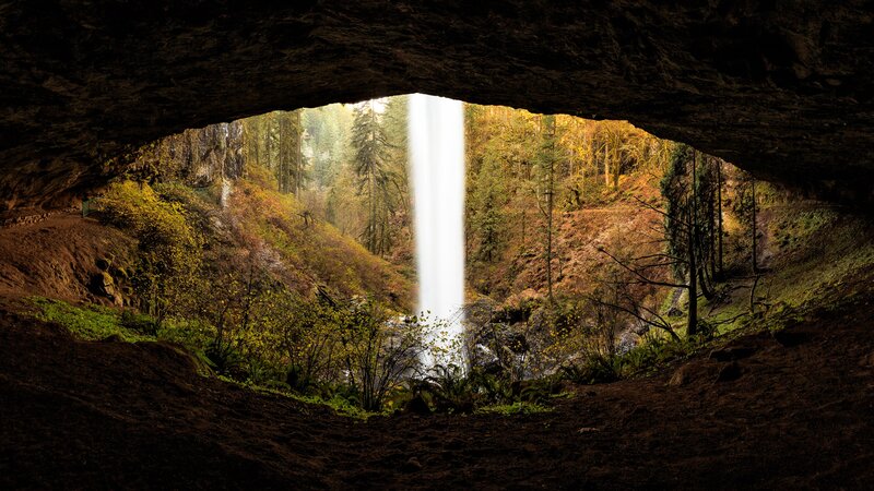 Waterfall Through Cave Opening — Brown, Serene