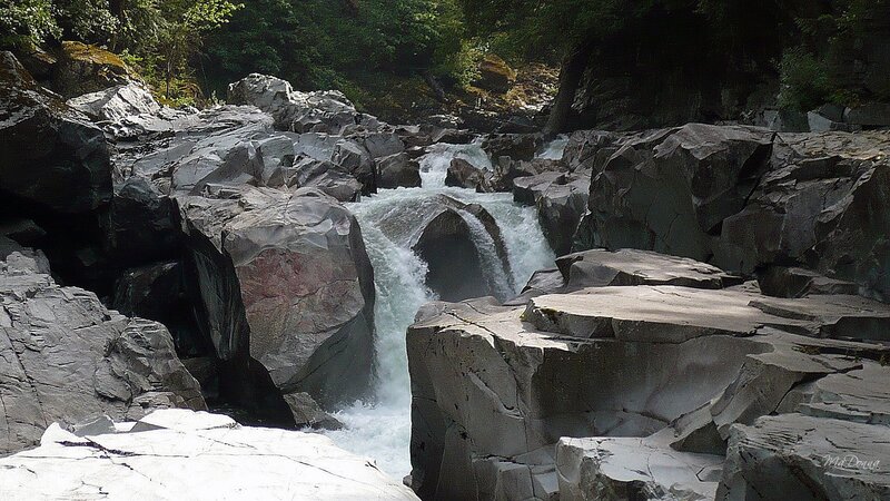 Waterfall through rocky canyon