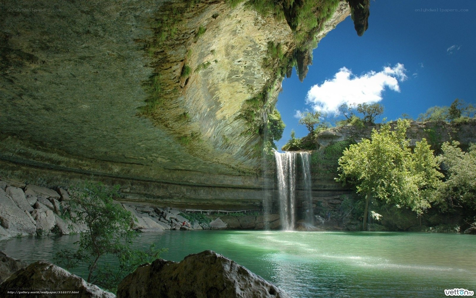 Waterfall under a rock overhang