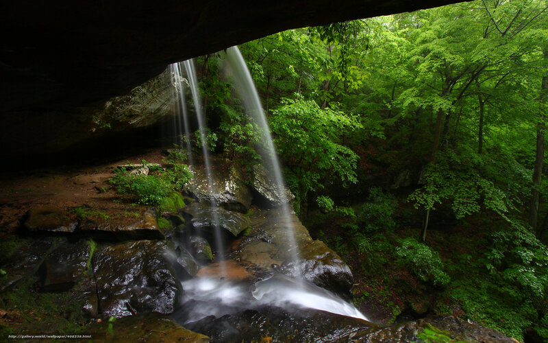 Waterfall under a rock overhang