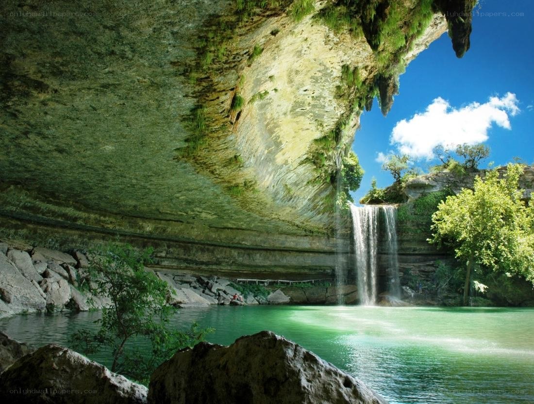 Waterfall under a rock overhang
