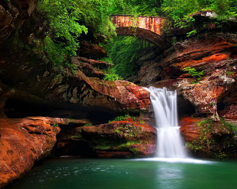 Waterfall under Stone Bridge — Green, Serene, Photograph, Rocks
