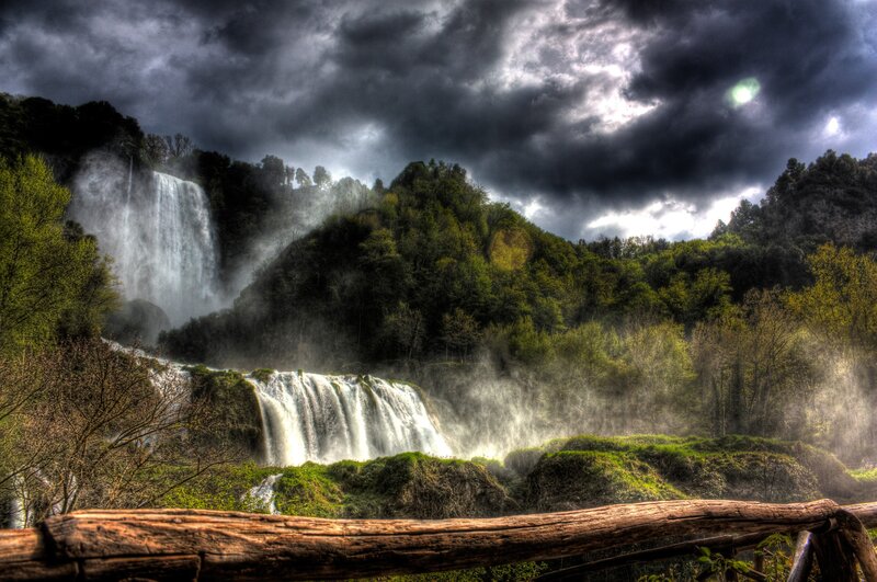 Waterfall under stormy sky
