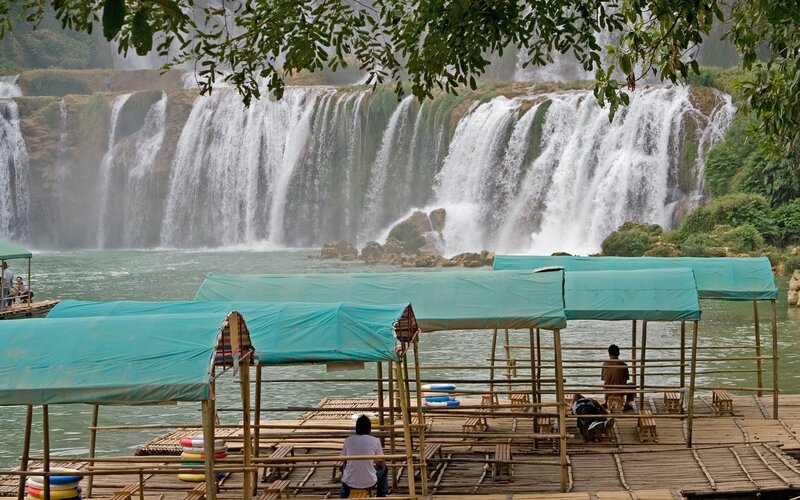 Waterfall with bamboo rafts