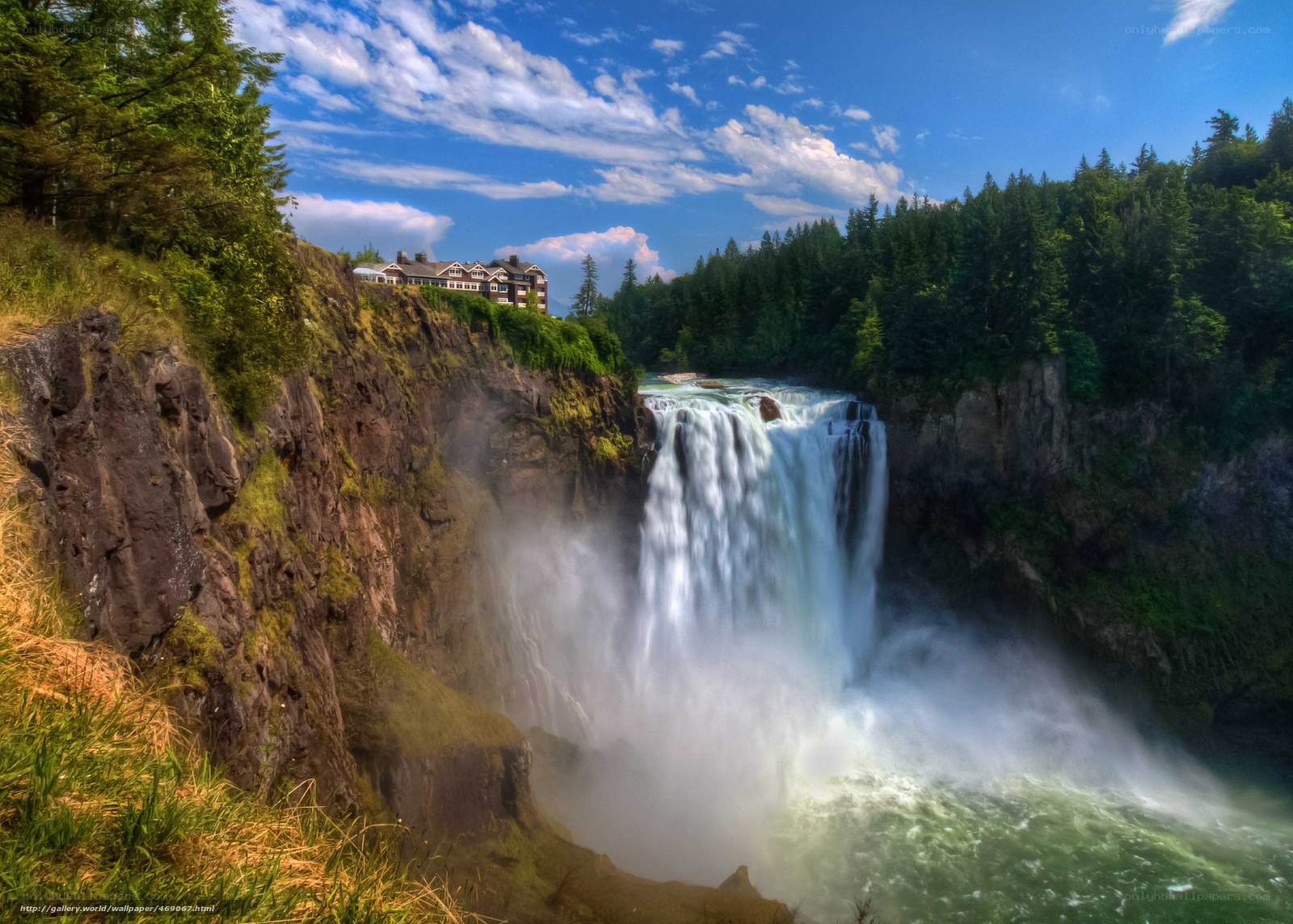 Waterfall with building on cliff