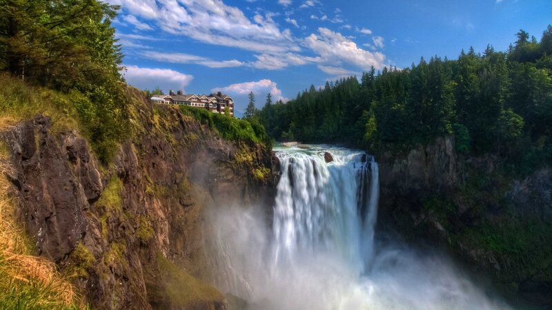 Waterfall with building on cliff