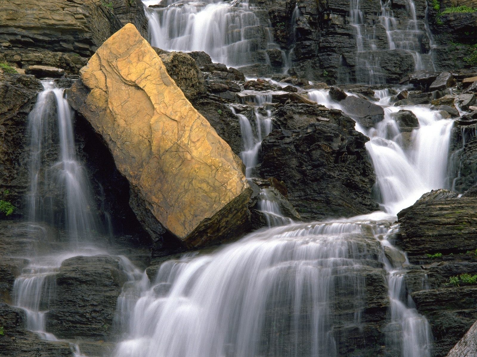 Waterfall with golden rock
