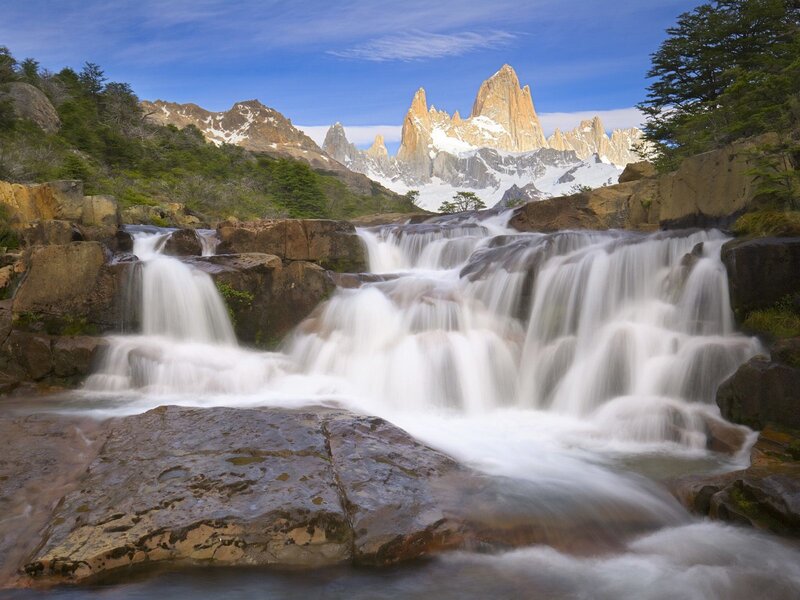Waterfall with mountain backdrop