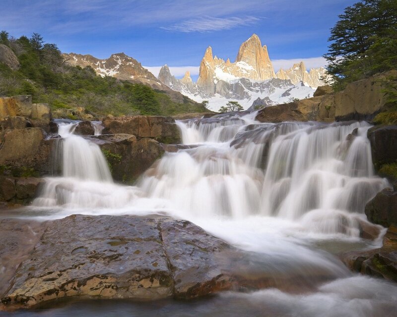 Waterfall with mountain backdrop
