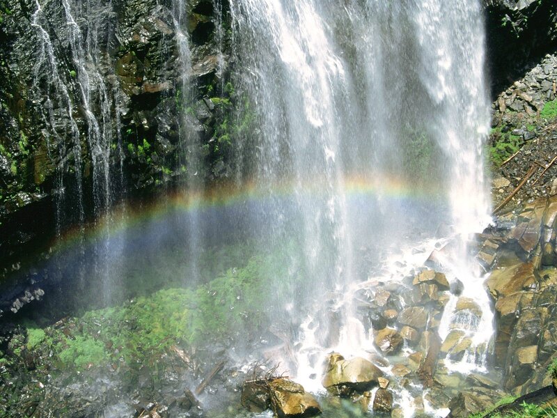 Waterfall with rainbow arc