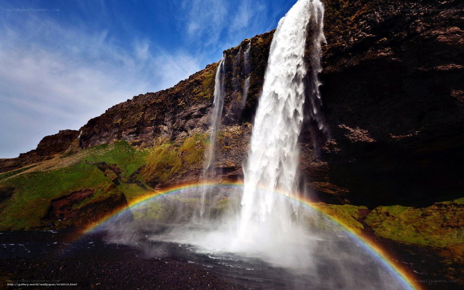 Waterfall with rainbow arc