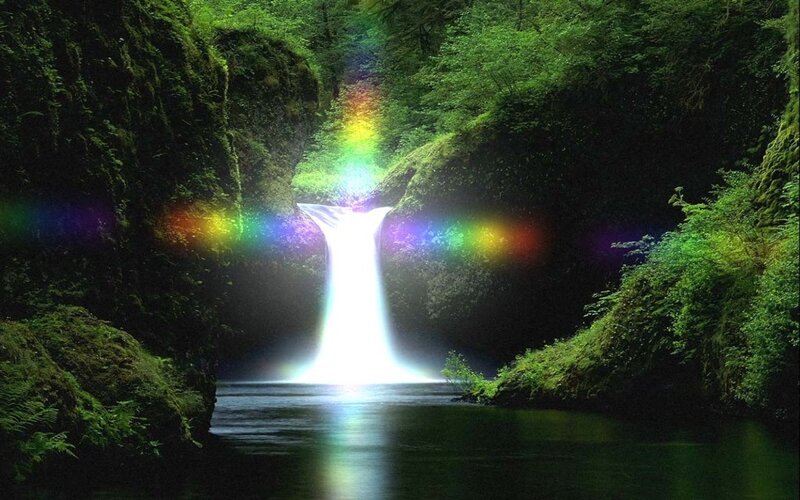 Waterfall with rainbow in forest