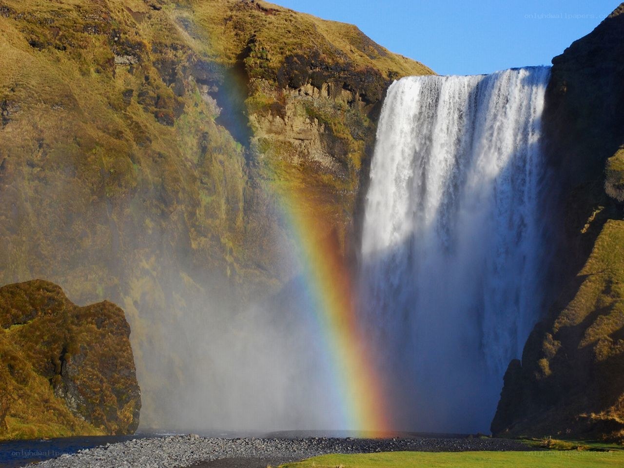 Waterfall with rainbow in Iceland