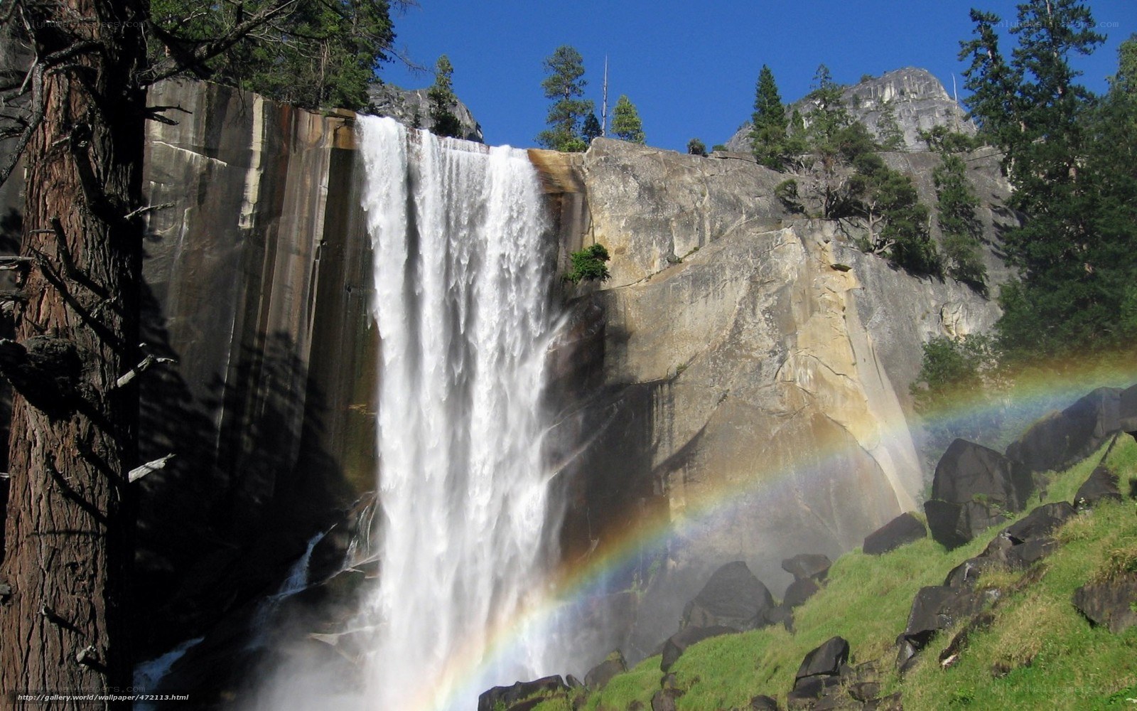 Waterfall with rainbow in Yosemite