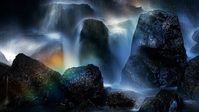 Waterfall with rainbow light