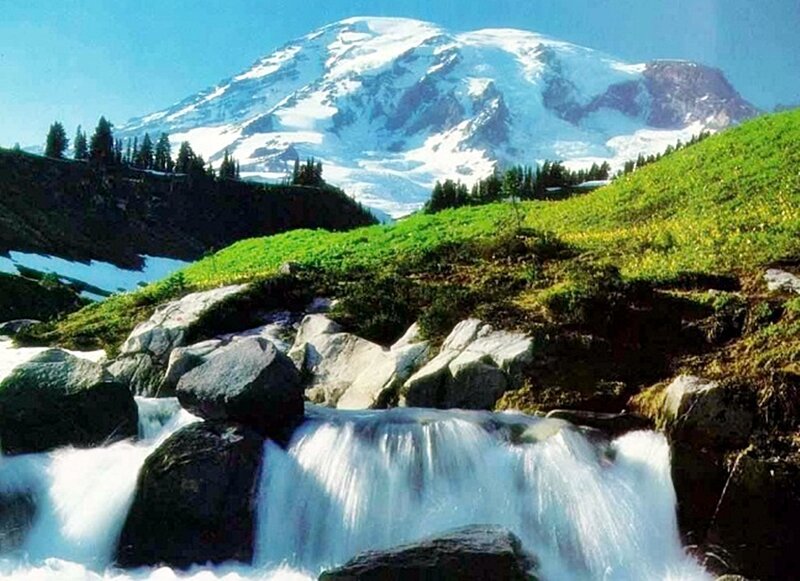Waterfall with snow-capped mountain