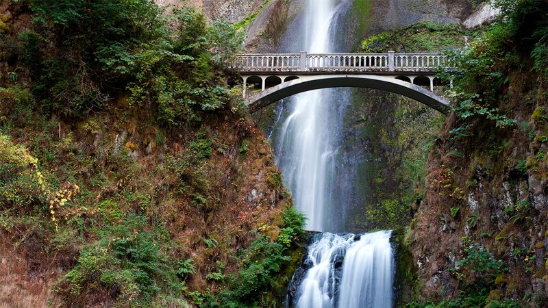 Waterfall with stone bridge